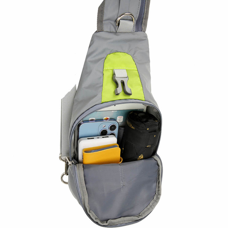 Laden Sie das Bild in Galerie -Viewer, Front quick-access pocket of the green sling bag open, holding a phone, keys on a carabiner and cards
