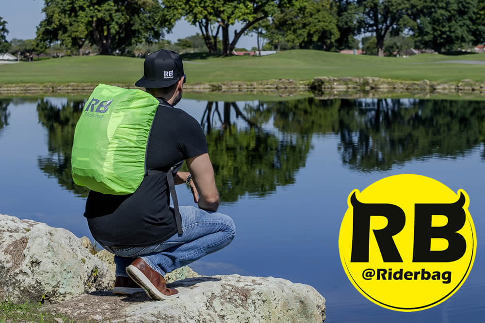 Rider wearing a waterproof backpack cover by rider bag