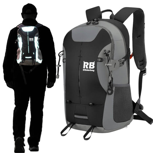 A gray and black backpack shown from the front on a white background, alongside a person in black clothing wearing the backpack from the back to demonstrate its reflective light-up feature. The backpack features a white 'RB backpack' logo on the front.