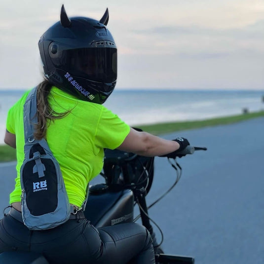 Woman Wearing Unisex Black Reflective Crossbody Sling Bag Shoulder Backpack